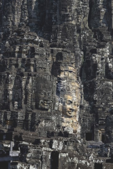 Huge stone-carved faces of Bodhisattva Lokeshvara, also Avalokiteshvara, Bayon Temple, Angkor Thom, UNESCO World Heritage Site, Angkor Wat, Siem Reap, Cambodia