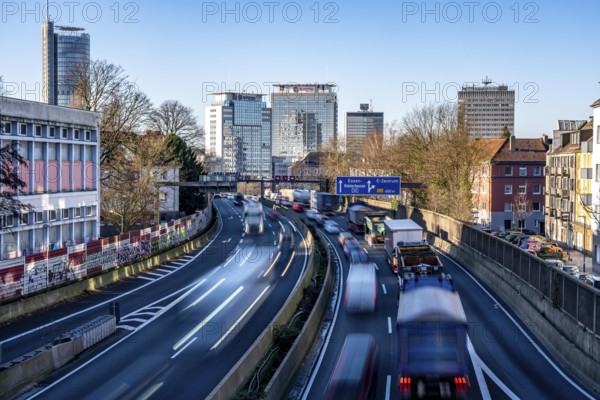 The A40 motorway, Ruhrschnellweg, in Essen, city skyline, Evonik office building, traffic jam in the westbound lane, Duisburg, slow traffic, North Rhine-Westphalia, Germany