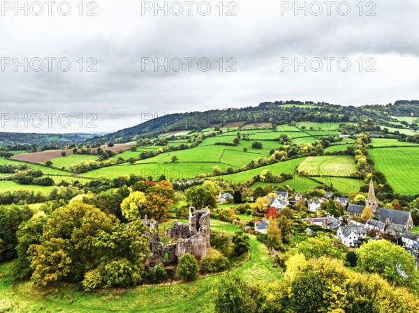 Autumn Colours over ruins of Grosmont Castle from a drone, Grosmont, Monmouthshire, Wales, UK