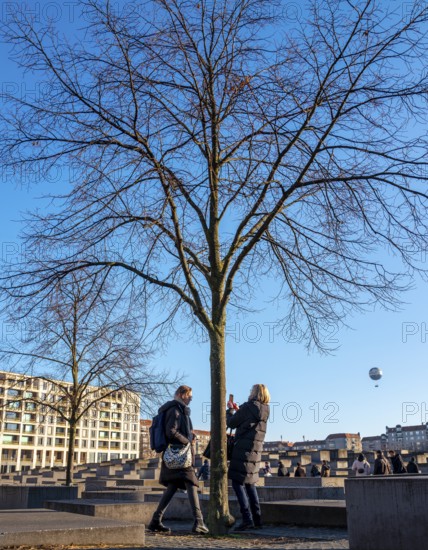 Tourists at the Memorial to the Murdered Jews of Europe, Behrenstraße, Berlin, Germany