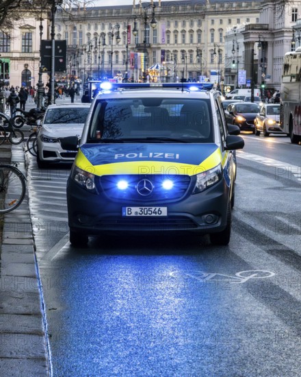 Police vehicles with flashing lights switched on, special operation at the Berlin State Library, Unter den Linden, Berlin, Germany