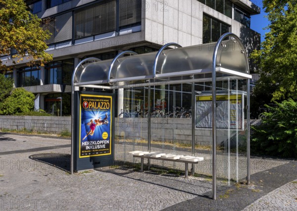 Bus stop with bus shelters and timetable at Ernst Reuter Platz in Berlin-Charlottenburg, Germany
