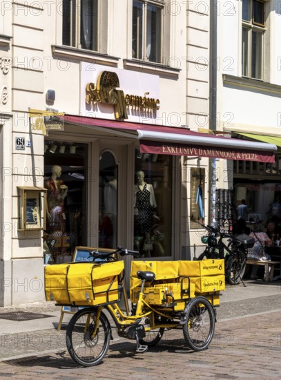 Deutsche Post bicycle loaded with luggage, letter and parcel delivery, Potsdam, Brandenburg, Germany