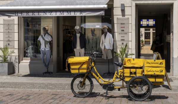 Deutsche Post bicycle loaded with luggage, letter and parcel delivery, Potsdam, Brandenburg, Germany