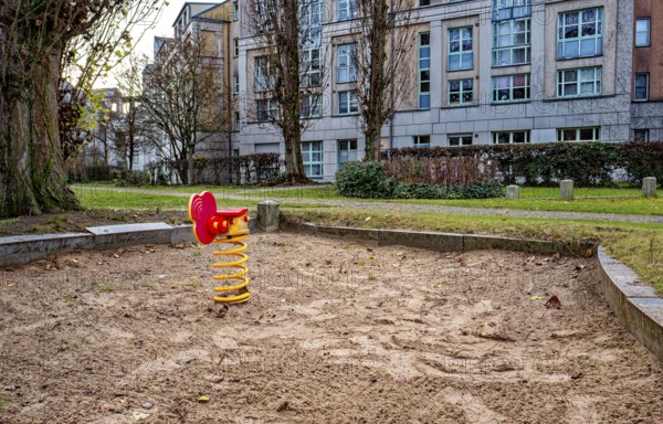 Orphaned children's playground with sandbox and small play equipment, Berlin, Germany