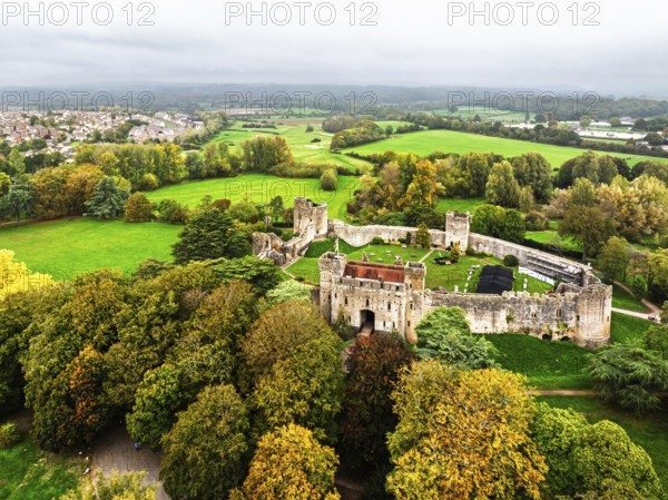 Autumn Colours over ruins of Caldicot Castle from a drone, Caldicot, Monmouthshire, Wales, UK