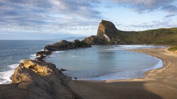 Deliverance Cove and Castle Rock, rocks, ocean, surf, morning. Castlepoint, Wairarapa Coast, Wellington Region, North Island, New Zealand