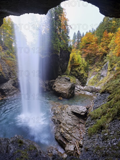 Waterfall mountain list in autumn-colored surroundings, Linthal, Klausenpass, Canton of Glarus, Switzerland