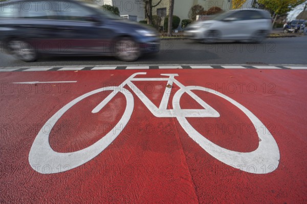 Car passing by the marked bicycle path, Röthebach, Mittelfranken, Bavaria, Germany