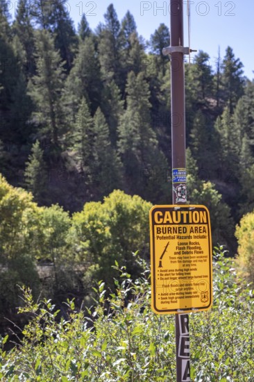 Gypsum, Colorado - A sign at an I-70 rest area in Glenwood Canyon warns of hazards that facing hikers in a burned area