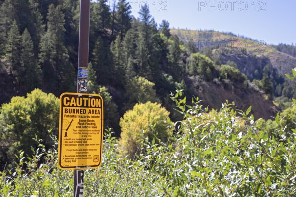 Gypsum, Colorado - A sign at an I-70 rest area in Glenwood Canyon warns of hazards that facing hikers in a burned area