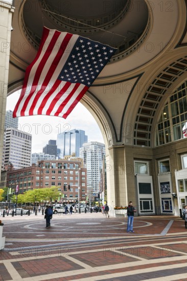 American flag fluttering, distinctive archway, Boston Harbor Hotel, Rowes Wharf, passers-by, Freedom Trail, Financial District, Downtown, Boston, Massachusetts, New England, USA