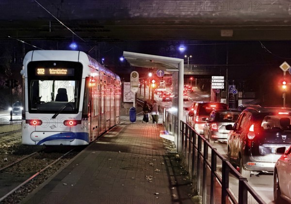 Bogestra tram line 302 at Ernst-Kuzorra-Platz der Kurt-Schumacher-Straße in the evening, Gelsenkirchen, North Rhine-Westphalia, Germany