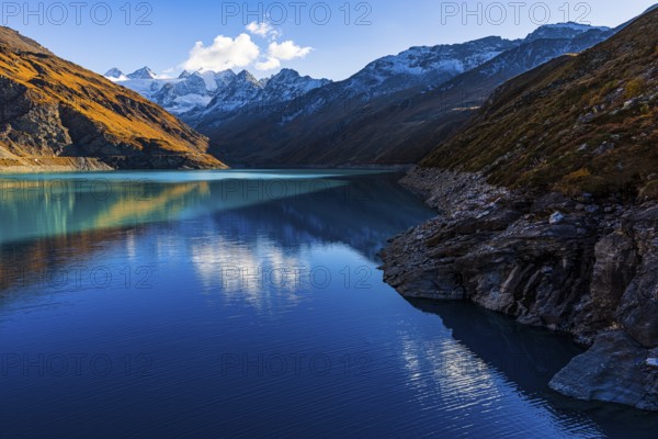 The turquoise Lac de Moiry reservoir, behind the peaks of the Grand Cornier, Tete Blanche and Pointe Moiry mountains, Val d'Anniviers, Valais Alps, Canton of Valais, Switzerland