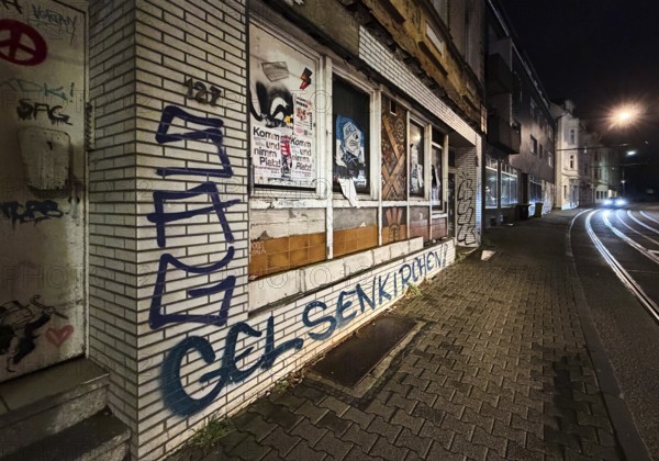 Decaying façade covered with graffiti, no-go area in Gelsenkirchen, one of the poorest cities in Germany, Ruhr area, North Rhine-Westphalia