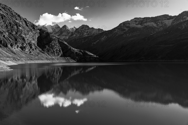The Lac de Moiry reservoir, in the background the peaks of the Grand Cornier, Tete Blanche and Pointe Moiry mountains, black and white photo, Val d'Anniviers, Valais Alps, Canton of Valais, Switzerland