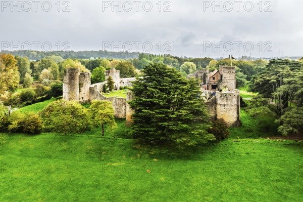 Autumn Colours over ruins of Caldicot Castle from a drone, Caldicot, Monmouthshire, Wales, UK