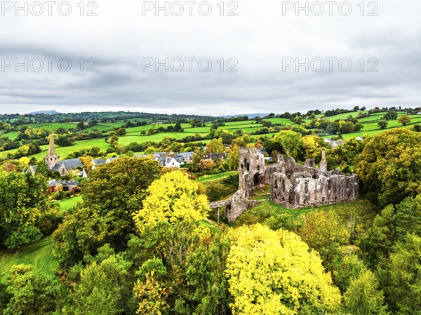 Autumn Colours over ruins of Grosmont Castle from a drone, Grosmont, Monmouthshire, Wales, UK