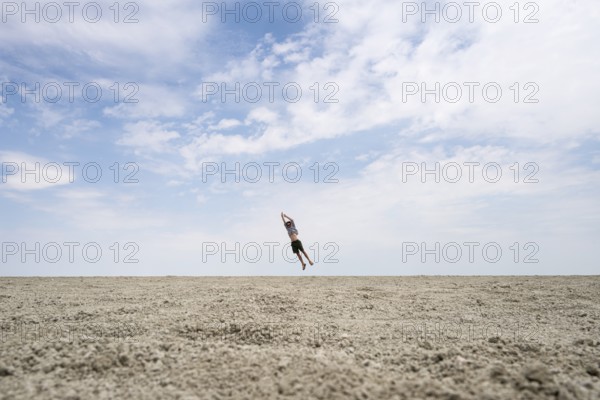 Symbolic picture, abstract, man at the Etosha pan, salt pan, Etosha National Park, Namibia