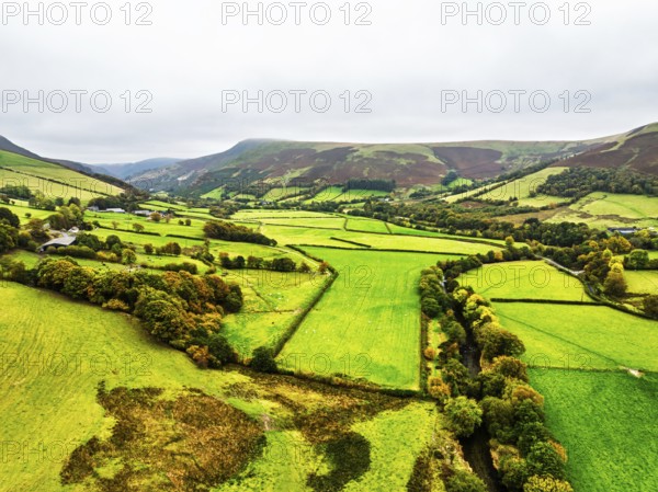 Autumn colours of Farms over River Wye and Road A470 from a drone, Llanidloes, Powys, Montgomeryshire, Wales, UK