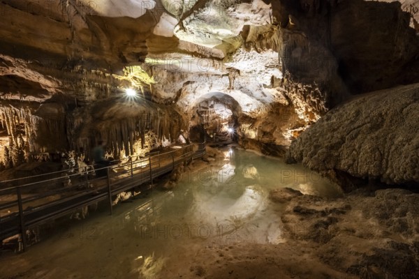 Stalactites and stalagmites, small underground lake, rock formations in a stalactite cave, Grotta del Fico, Gulf of Orosei, Baunei, Sardinia, Italy