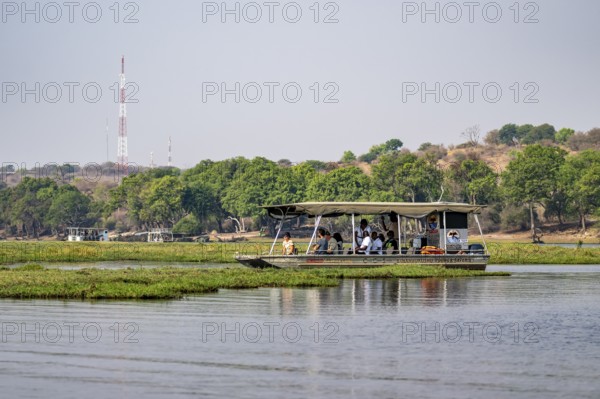 Tourist safari boat in Chobe River, Chobe Waterfront, Ihaha, Chobe National Park, Botswana