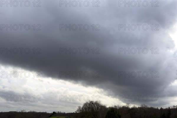 Large grey cloud roller Stratocumulus cluster layer cloud during high winter conditions, international