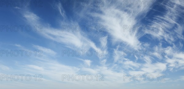 Clear Blue Sky with Whispy White Clouds - Perfect for Nature and Weather Backgrounds