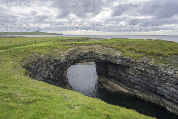 Bridges of Ross rock arch, Kilballyowen, County Clare, Ireland
