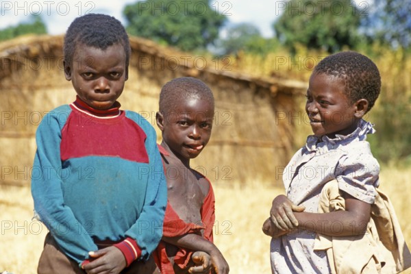 Children posing for the camera on the side of the road, Bwangu Mzimba, Malawi, Africa, June 2000, vintage, retro, old, historical
