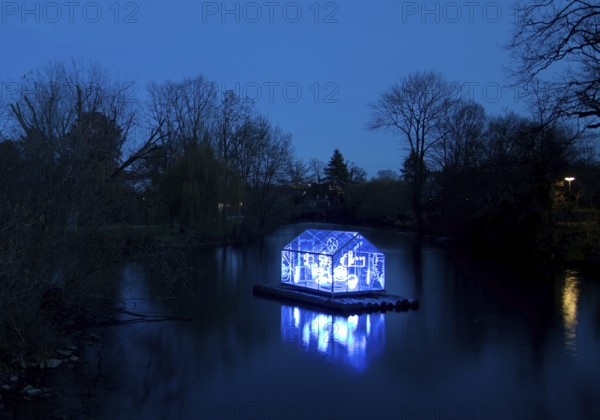 The river Lippe with the artwork Arche by Christoph Hildebrand at night, Lichtpromenade Lippstadt, North Rhine-Westphalia, Germany