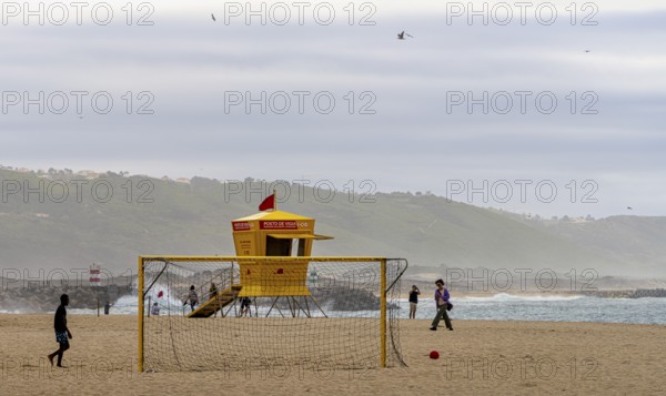 Yellow lifeguard surveillance container on Nazare beach, Portugal