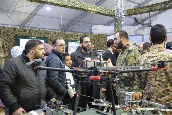 On 07 December 2025, in Damascus, Syria, a military exhibition showcased armored vehicles, weapons, and defense equipment, offering visitors an insight into the country's developing military industry. The event drew officials, diplomats, and attendees, coinciding with the first anniversary of Assad's fall, and highlighted advancements in locally produced military technology, Damascus, Damascus, Syria