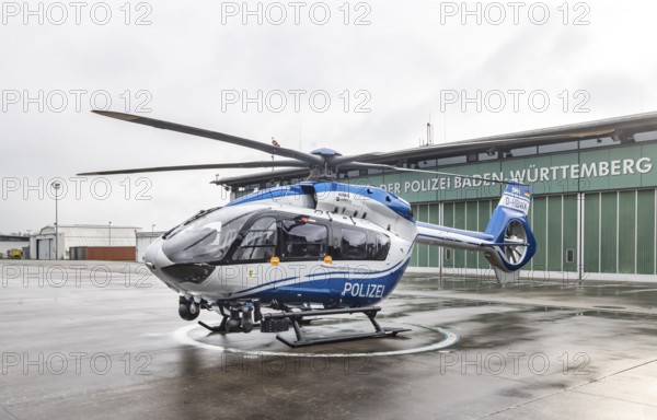 Helicopter from the Baden-Württemberg Police team in front of the hangar at the airport. Airbus Helicopters H145. Stuttgart, Baden-Württemberg, Germany