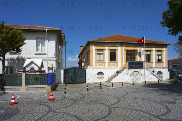 Cobblestone street with historic buildings and a Turkish flag, museum, Naval Museum, Canakkale, Marmara region, Turkey