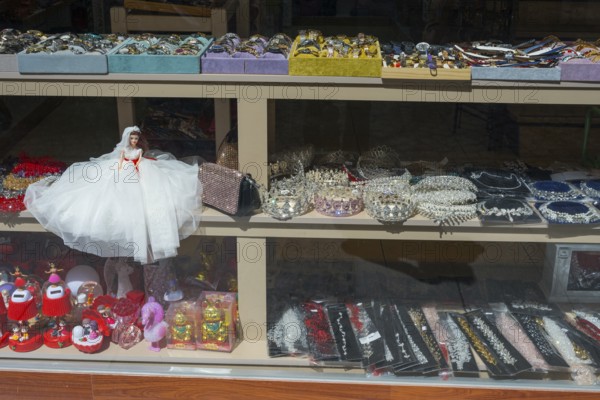 Shop window with a bridal doll and a variety of jewelry and decorations, Çanakkale, Canakkale, Marmara region, Turkey