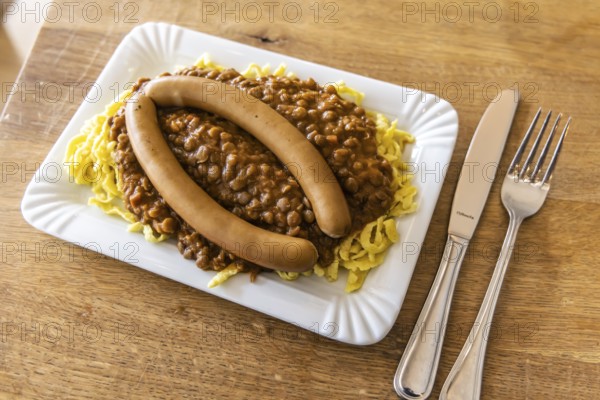 Swabian favorite dish. Lentils, spaetzle, side sausage. Stuttgart, Baden-Württemberg, Germany