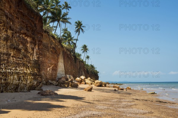 Lonely beach with red rocks and coconut trees, Red Cliffs, Bang Saphan Noi, Prachuap Khiri Khan Province, Central Thailand, Thailand