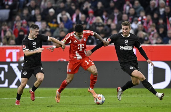 Duel, action Luis Diaz FC Bayern Munich FCB (14) (center) against Hauke Wahl FC St. Pauli (05) (right) Arkadiusz Pyrka FC St. Pauli (11) (left) Allianz Arena, Munich, Bayern, Germany