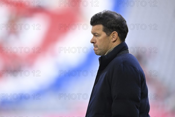 TV expert Michael Ballack in front of Logo FC Bayern Munich, thoughtful Allianz Arena, Munich, Bavaria, Germany