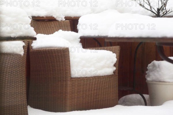 Snow-covered garden chairs, winter, Germany