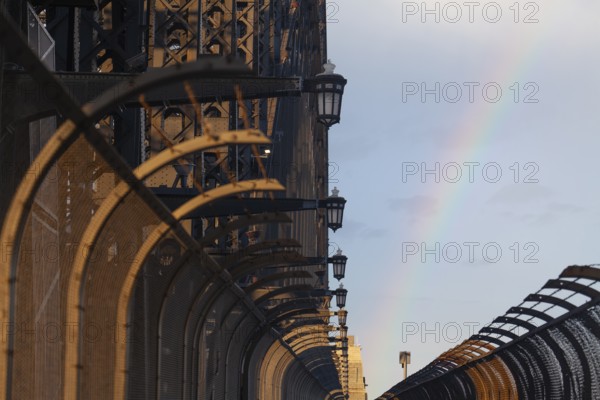 Details of the famous Sydney Harbour Bridge in the evening light with a rainbow. New South Wales, Australia