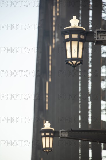 Details of the famous Sydney Harbour Bridge in the evening light, New South Wales, Australia. Decorative lamps on steel arm with rivets