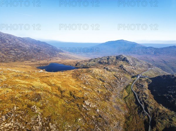 Autumn colours over Llyn Cwmffynnon and Miner's Track, Start Point, road A4086 from a drone, Pen-y-Pass, Snowdonia, Wales, UK