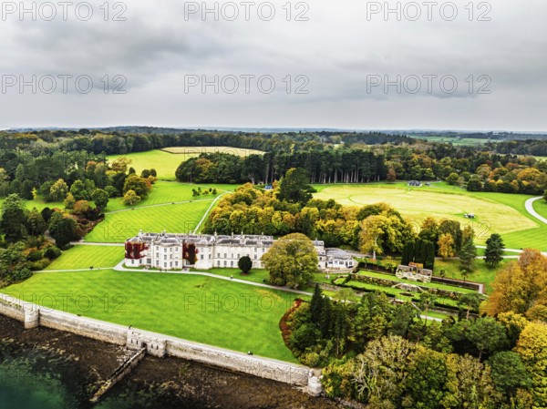 Autumn over Plas Newydd House from a drone, Gardens and Parkland, Llanfairpwllgwyngyll, Anglesey, Wales, UK
