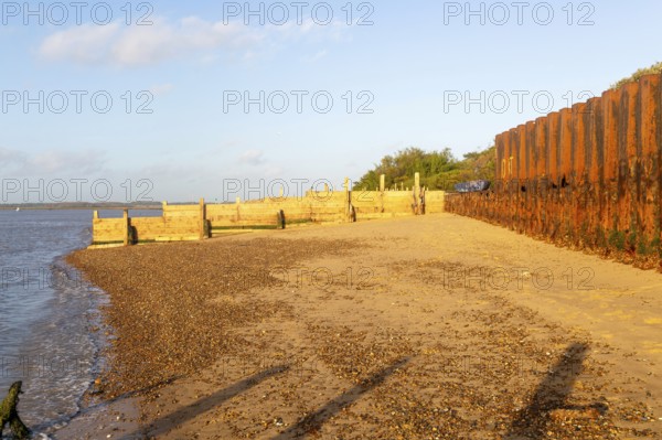 Temporary coastal defences erected by Bawdsey Haven Yacht Club, response to rapid erosion beach depletion, River Deben, Bawdsey, Suffolk, England, UK Nov 2025
