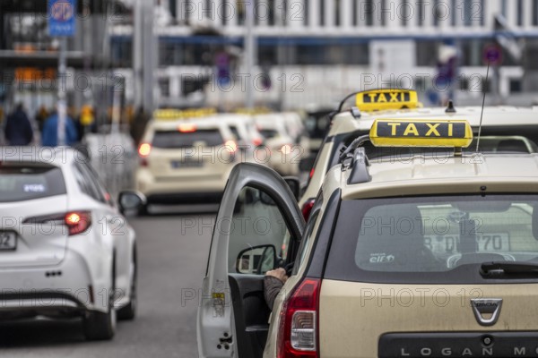 Taxis in front of the main train station in Berlin, waiting in line for passengers, Germany