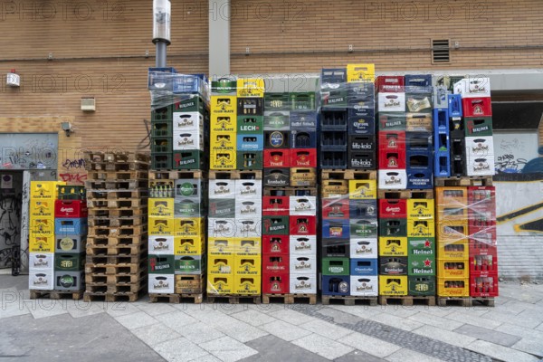 Empty beverage crates, from various manufacturers, bottling, types, stacked at a restaurant, for transport, deposit system, Germany