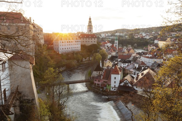 Spring morning sunrise with castle view over the rooftops of Krumlov in southern Bohemia, Czech Republic