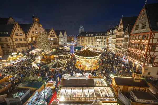 With the lighting on the Mrs. Holle Christmas tree, a 30-meter high Nordmann fir tree, the Frankfurt Christmas Market was officially opened on 24.11.2025. The Christmas market will be open until December 22 from Monday to Saturday from 10:00 to 21:00 and on Sundays from 11:00 to 21:00, Römerberg, Frankfurt am Main, Hesse, Germany